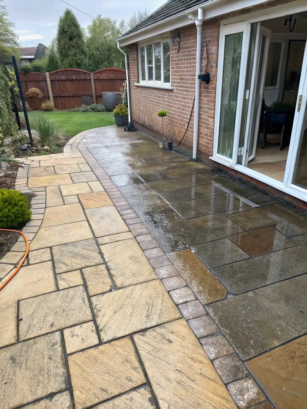A before-and-after photo of a wooden deck, highlighting the transformation after cleaning, used to illustrate deck and patio cleaning services.